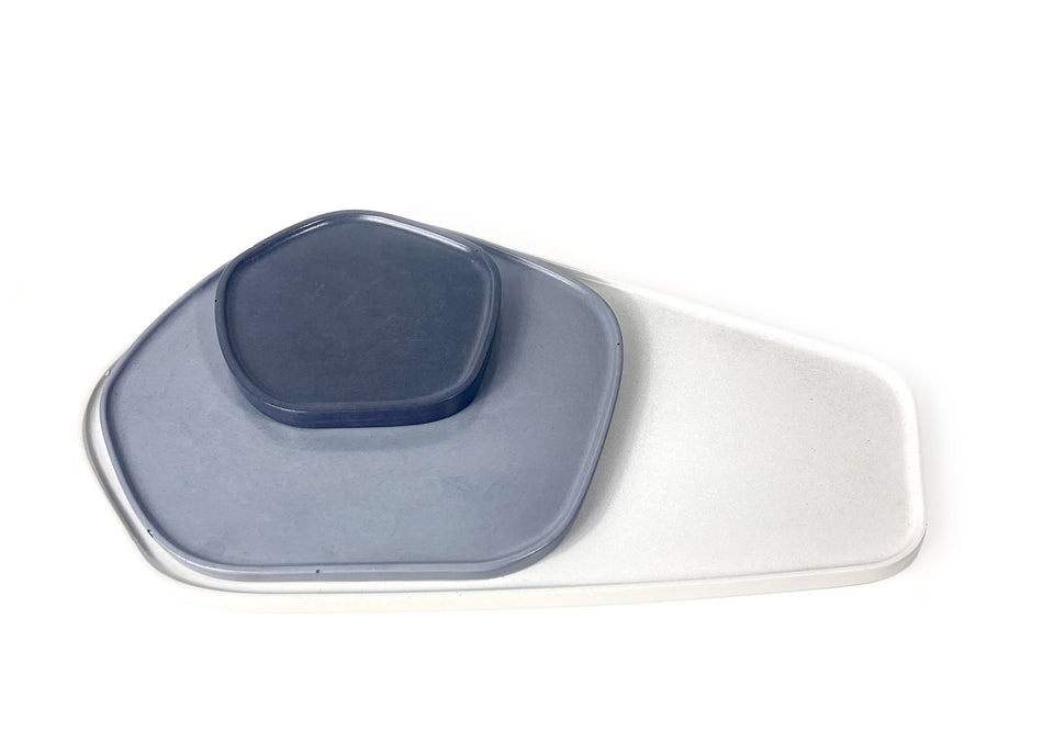 Large off-white organic shaped tray, medium gray organic shaped tray, and small charcoal organic shaped tray, pictured stacked